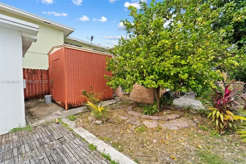 a view of a backyard of the house