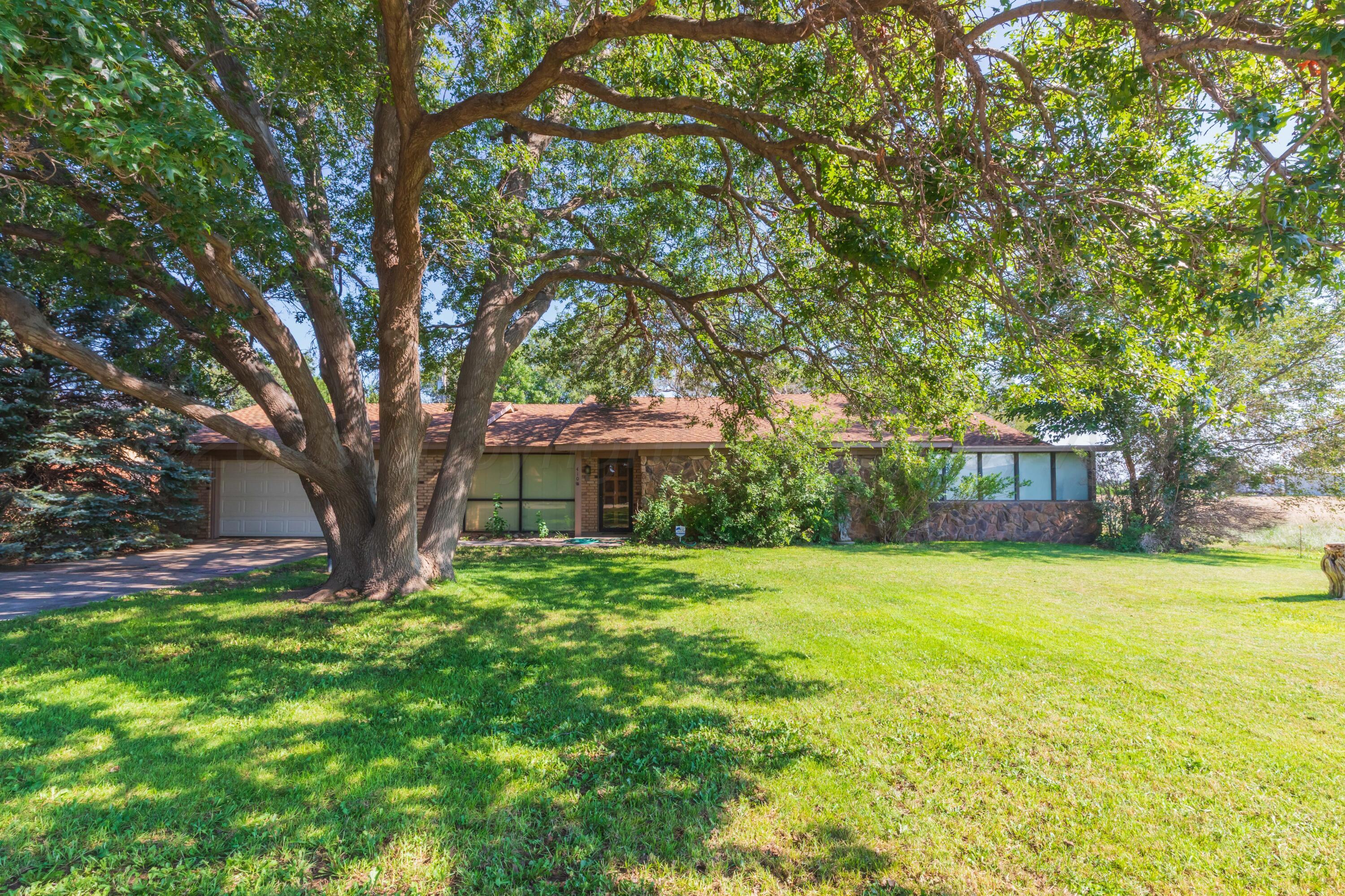 410 Creekside Drive Amarillo, TX 79124 - Photo 2 of 46 a view of a house with a yard