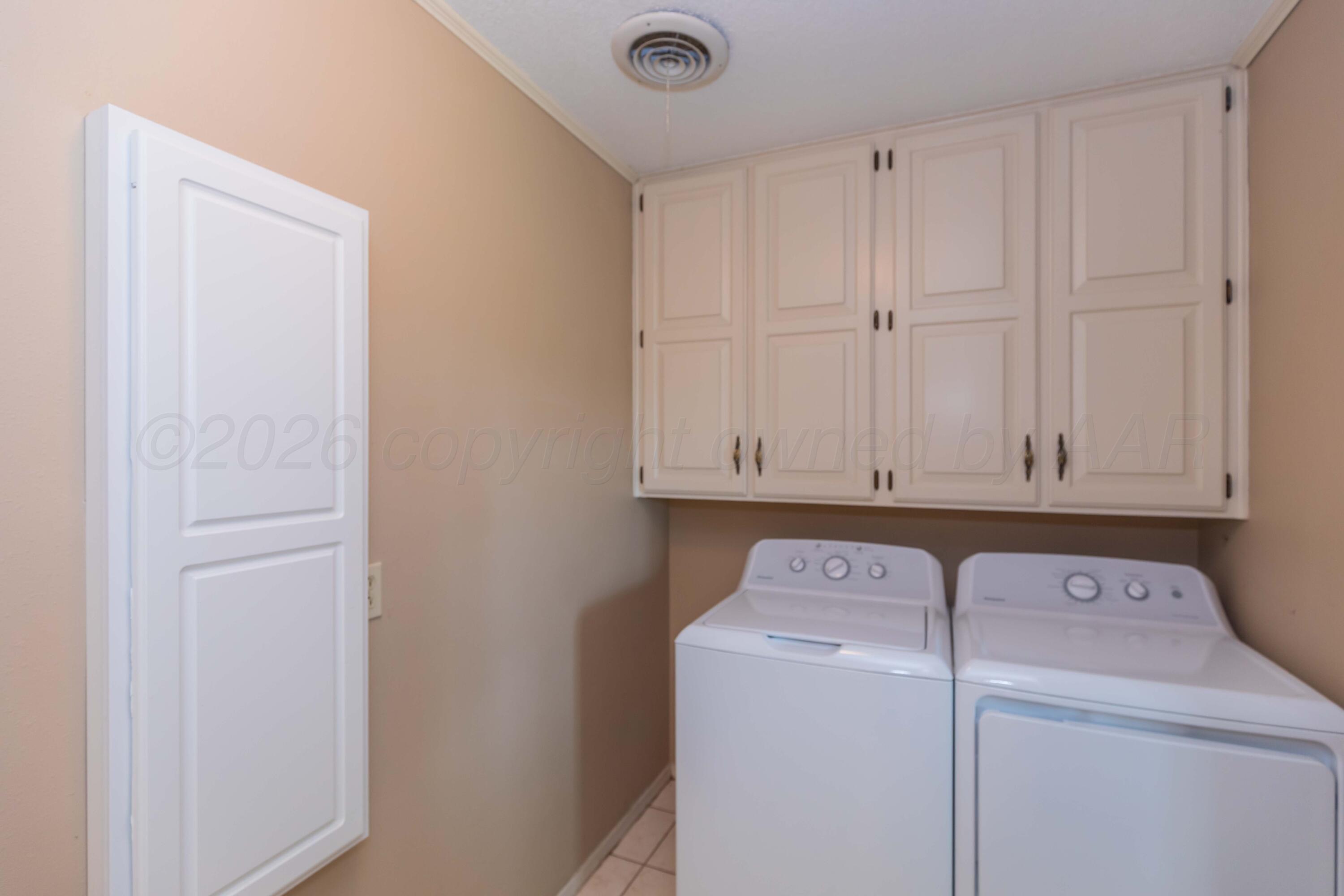 410 Creekside Drive Amarillo, TX 79124 - Photo 21 of 46 a view of storage and utility room with washer and dryer