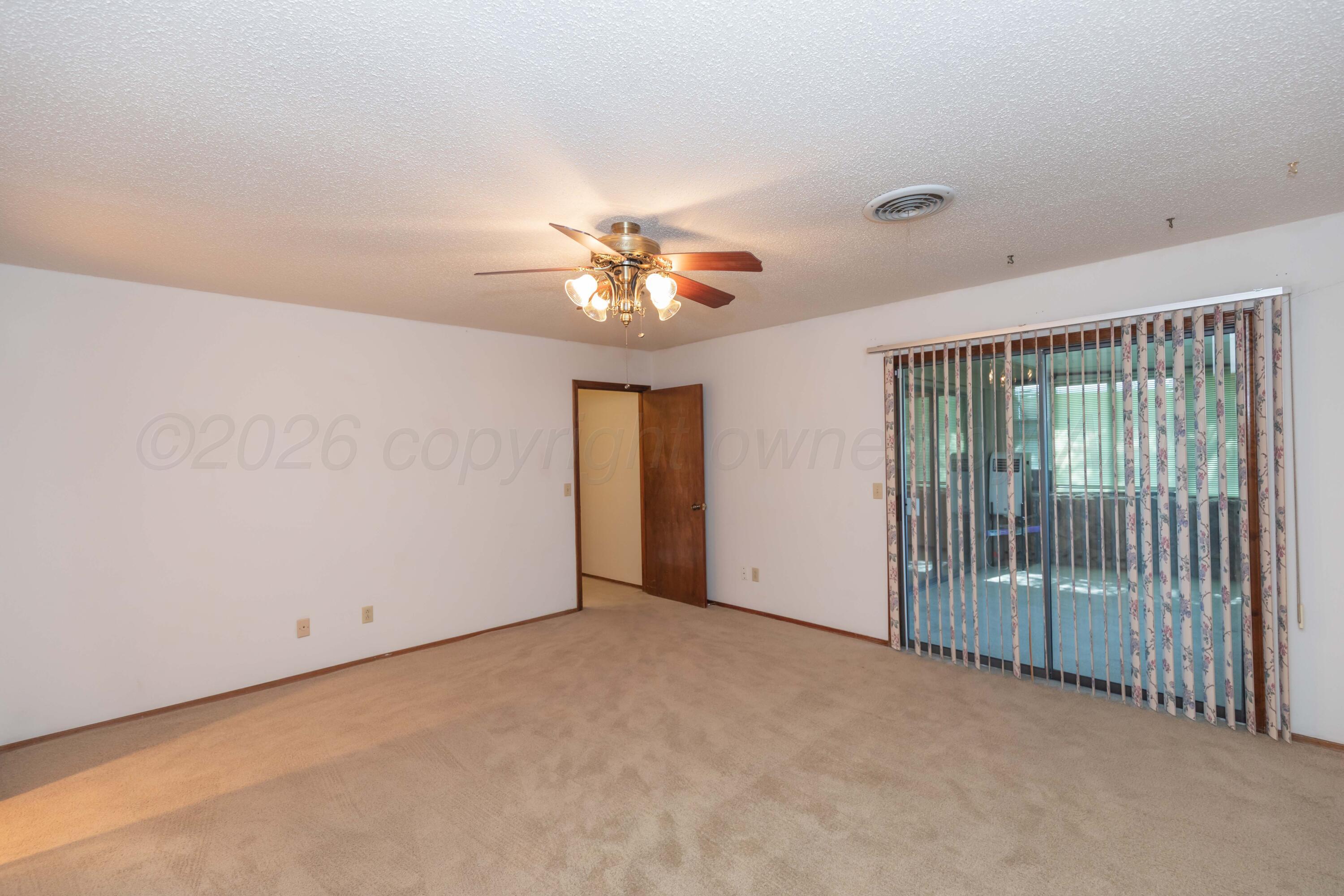 410 Creekside Drive Amarillo, TX 79124 - Photo 26 of 46 a view of a livingroom with a chandelier fan
