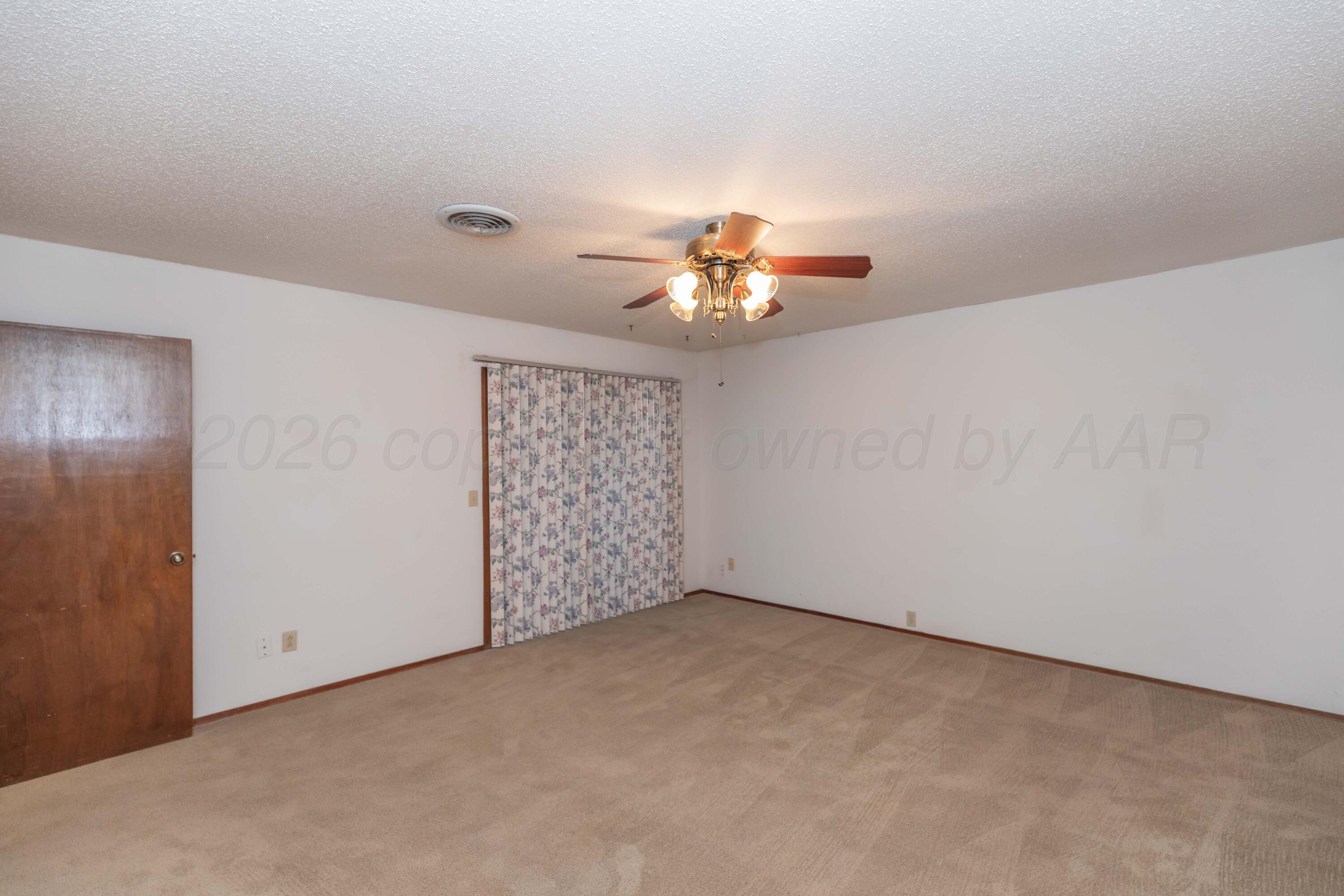 410 Creekside Drive Amarillo, TX 79124 - Photo 27 of 46 a view of an empty room with a window