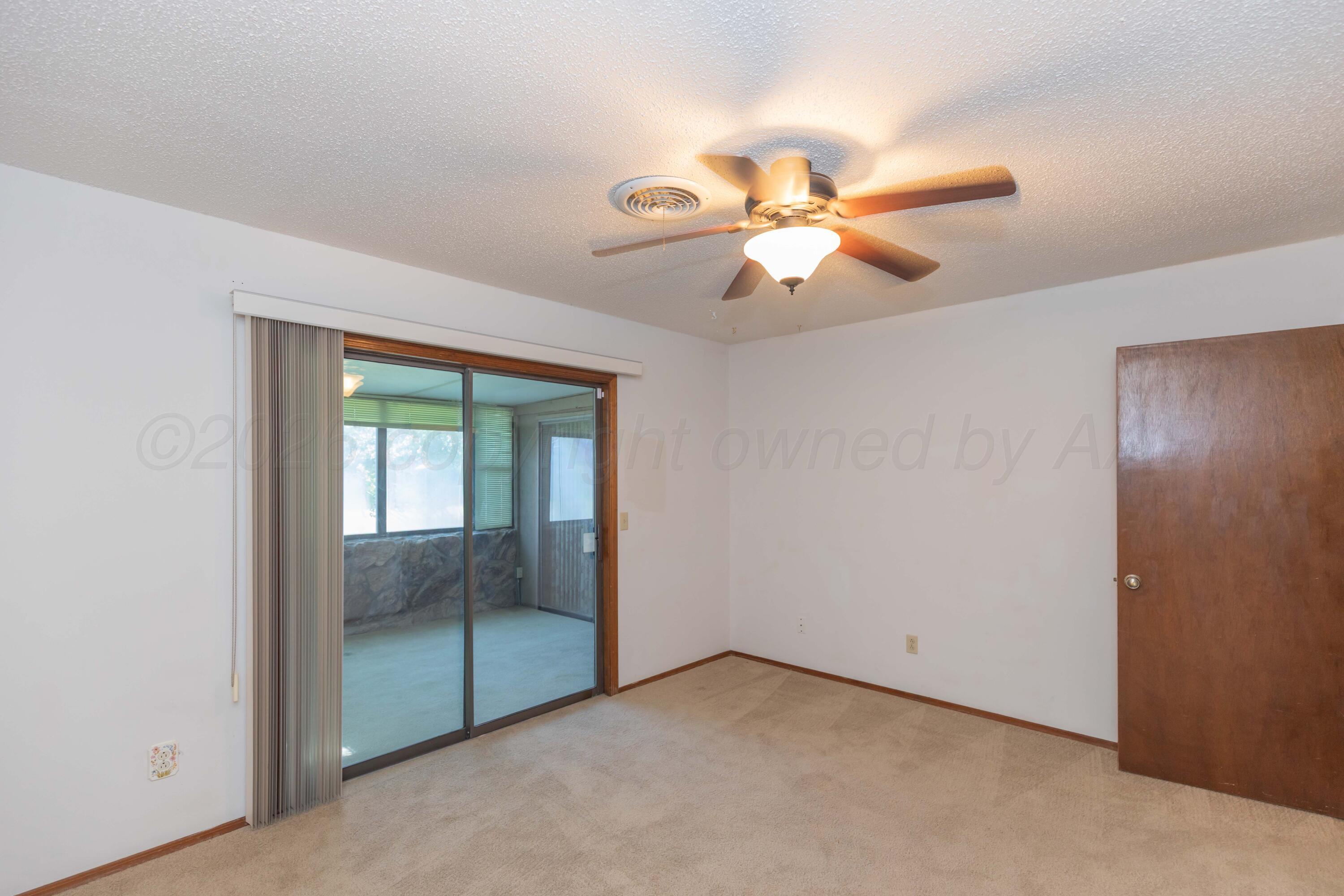 410 Creekside Drive Amarillo, TX 79124 - Photo 31 of 46 an empty room with fan