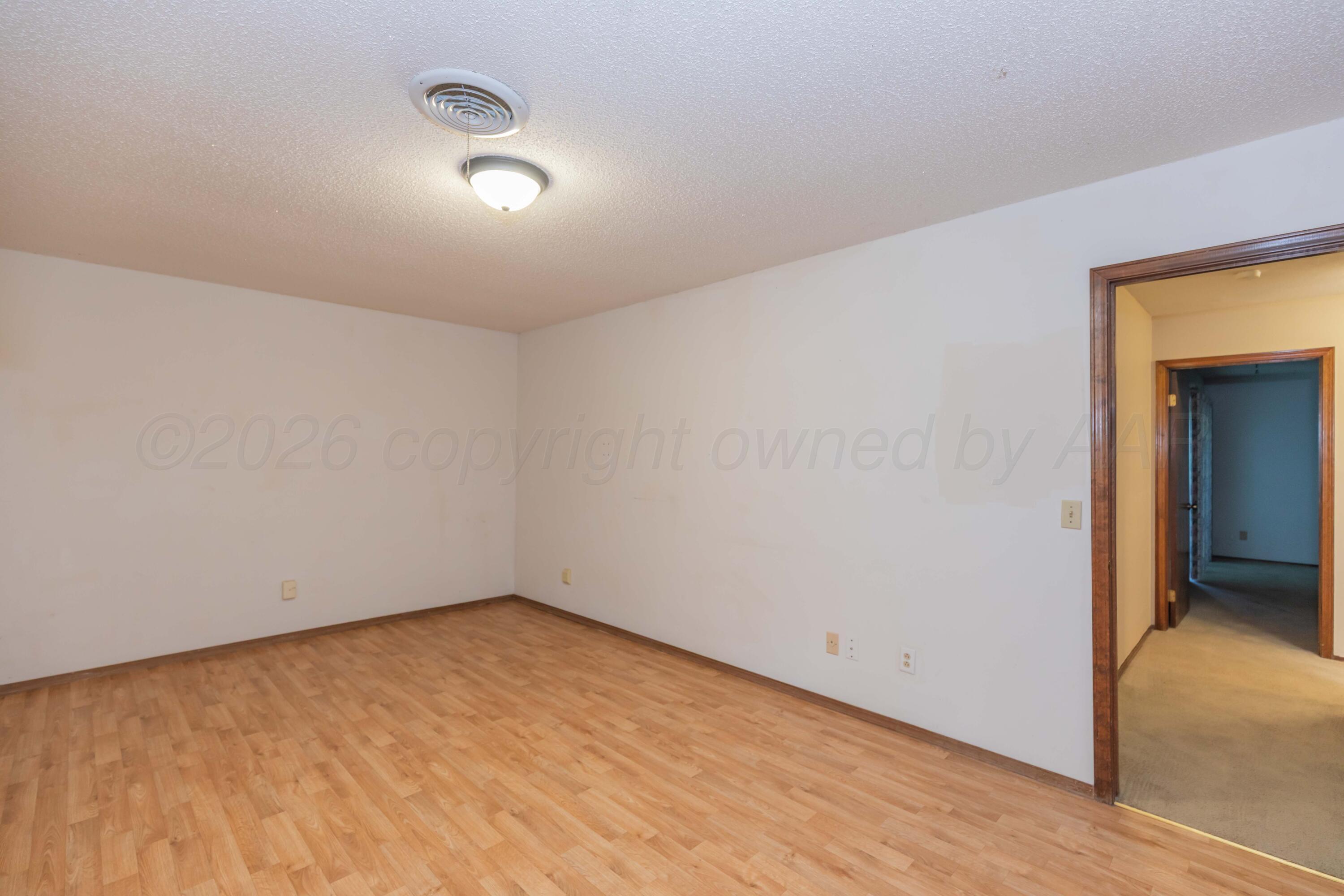 410 Creekside Drive Amarillo, TX 79124 - Photo 34 of 46 an empty room with a natural light
