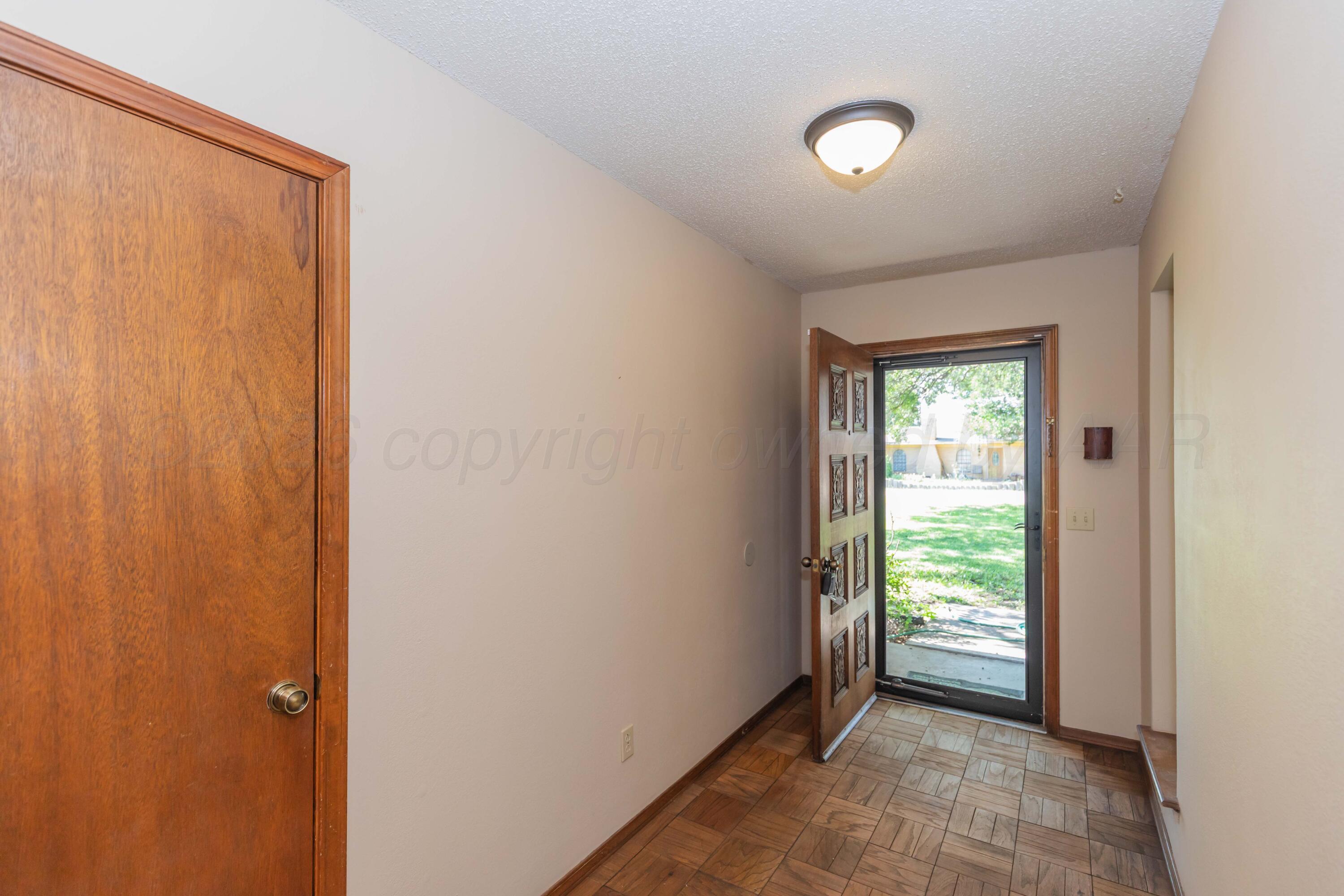 410 Creekside Drive Amarillo, TX 79124 - Photo 5 of 46 a view of an empty room and window