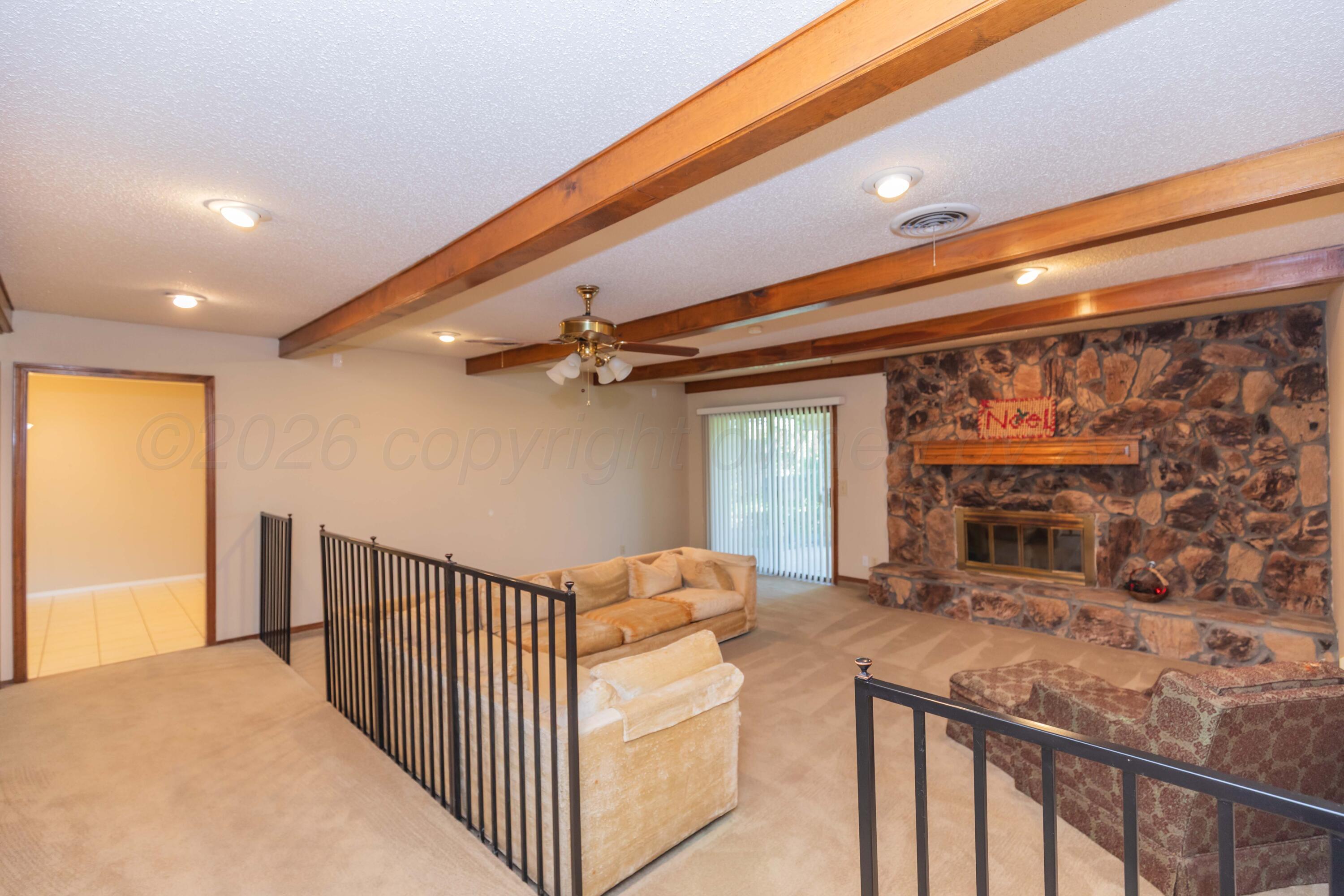 410 Creekside Drive Amarillo, TX 79124 - Photo 6 of 46 a view of a porch with furniture and a ceiling fan
