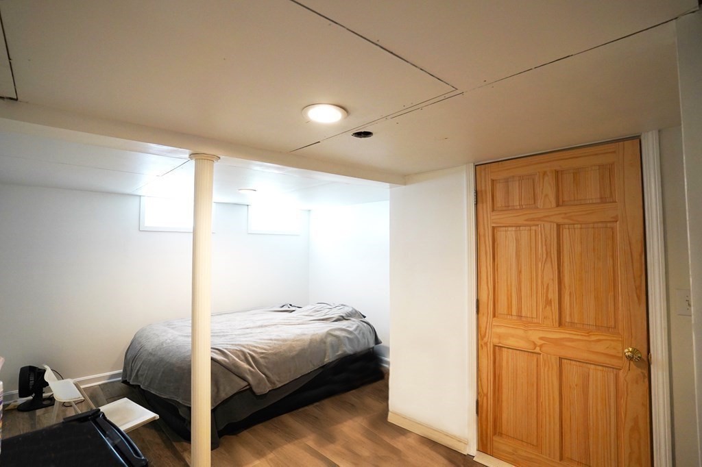 43 Alpine Place Franklin, MA 02038 - Photo 11 of 19 a bedroom with a bed and wooden floor