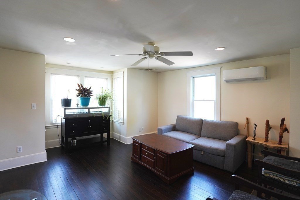 43 Alpine Place Franklin, MA 02038 - Photo 3 of 19 a living room with furniture and a wooden floor