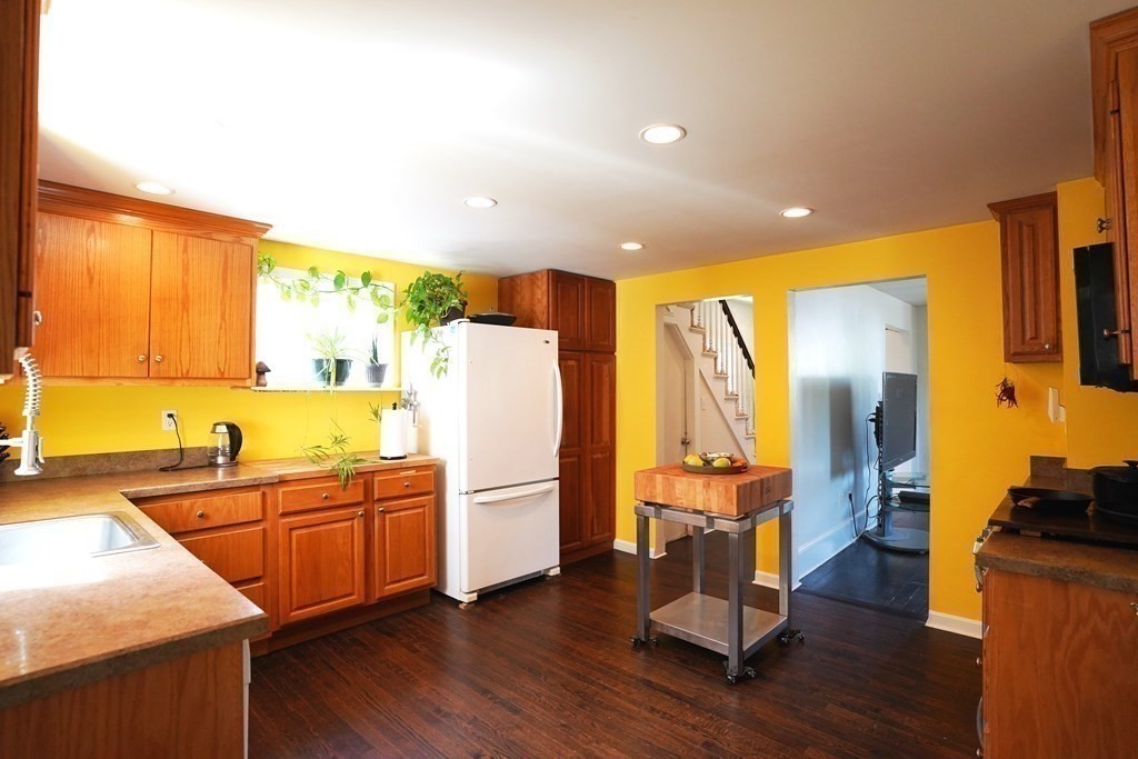 43 Alpine Place Franklin, MA 02038 - Photo 4 of 19 a kitchen with sink a refrigerator and wooden floor
