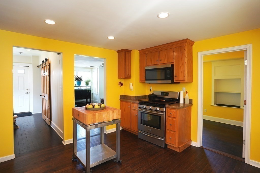 43 Alpine Place Franklin, MA 02038 - Photo 7 of 19 a room with furniture and a flat screen tv