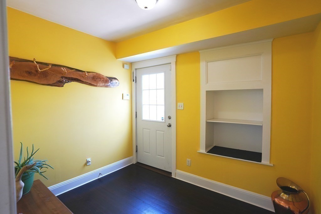 43 Alpine Place Franklin, MA 02038 - Photo 8 of 19 a view of a room with wooden floor and a ceiling fan