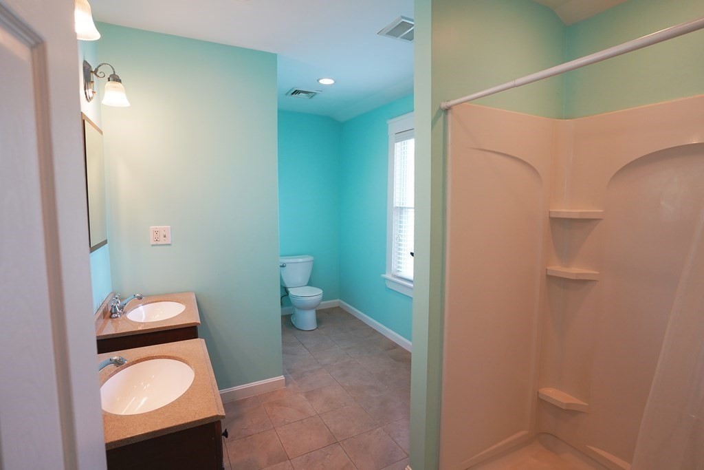 43 Alpine Place Franklin, MA 02038 - Photo 10 of 19 a bathroom with a toilet and a sink