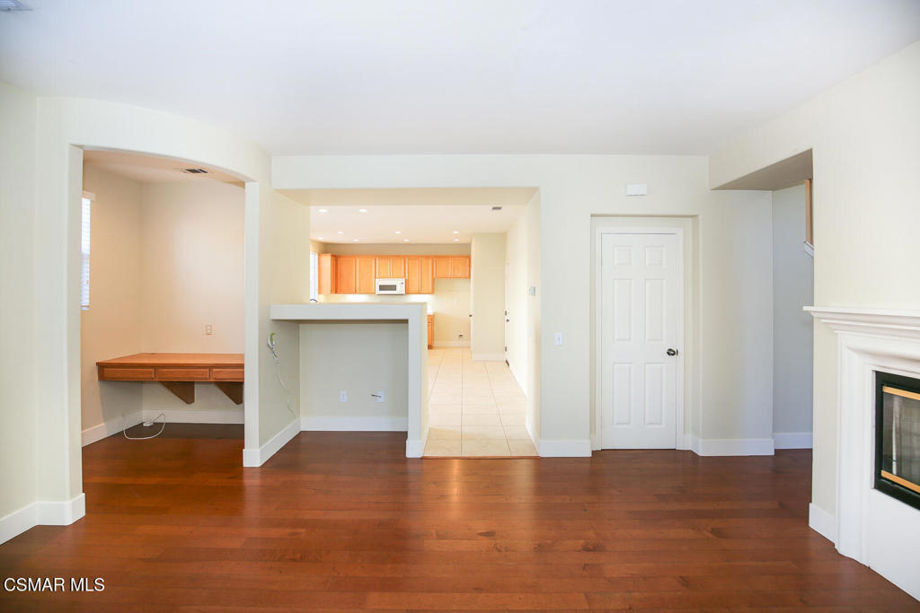1129 Azalea Way Simi Valley, CA 93065 - Photo 15 of 49 a view of a room with wooden floor and a fireplace