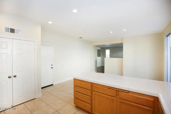 a spacious bathroom with a sink and a mirror