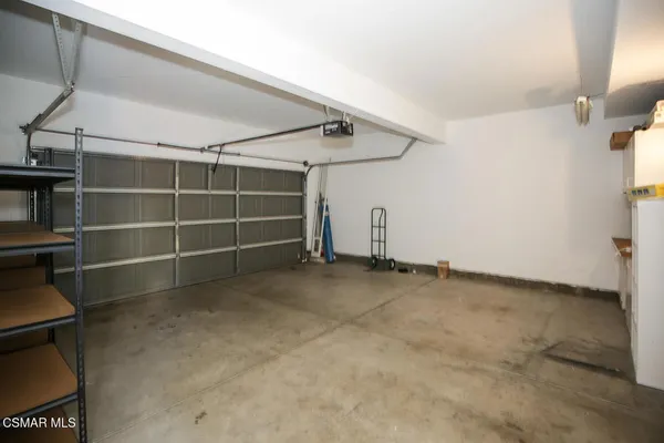 a view of an empty room with a staircase