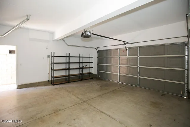 a view of an empty room with a staircase