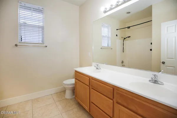 a bathroom with a bathtub a toilet and a shower