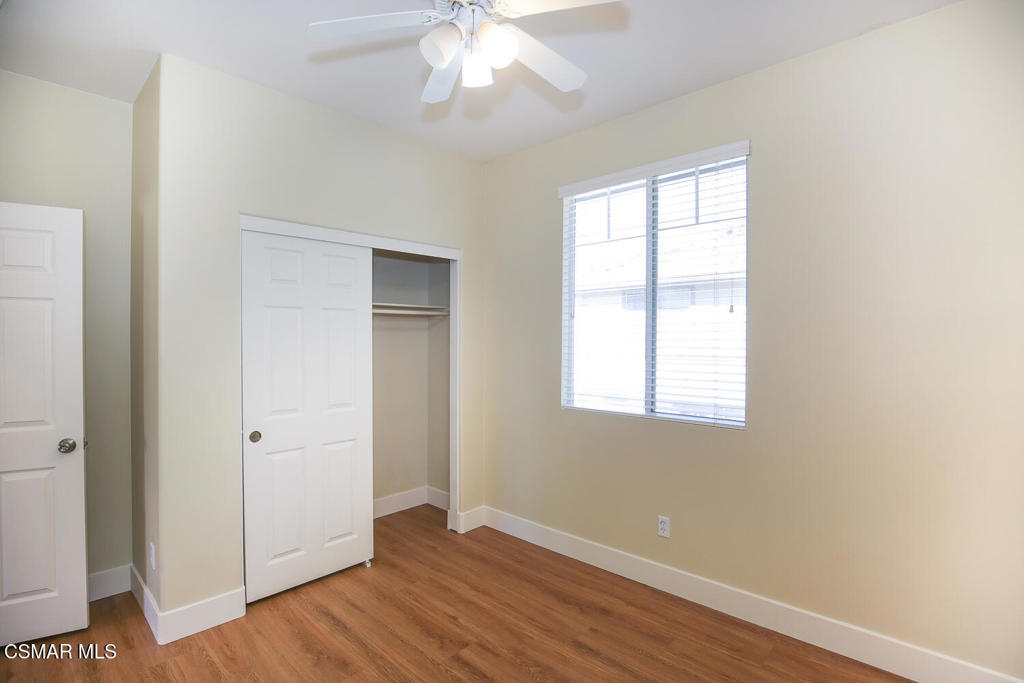 1129 Azalea Way Simi Valley, CA 93065 - Photo 42 of 49 a view of an empty room with wooden floor and a window