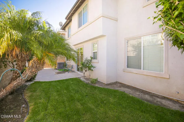 a view of a back yard of the house