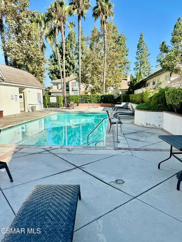 a view of a swimming pool with a patio