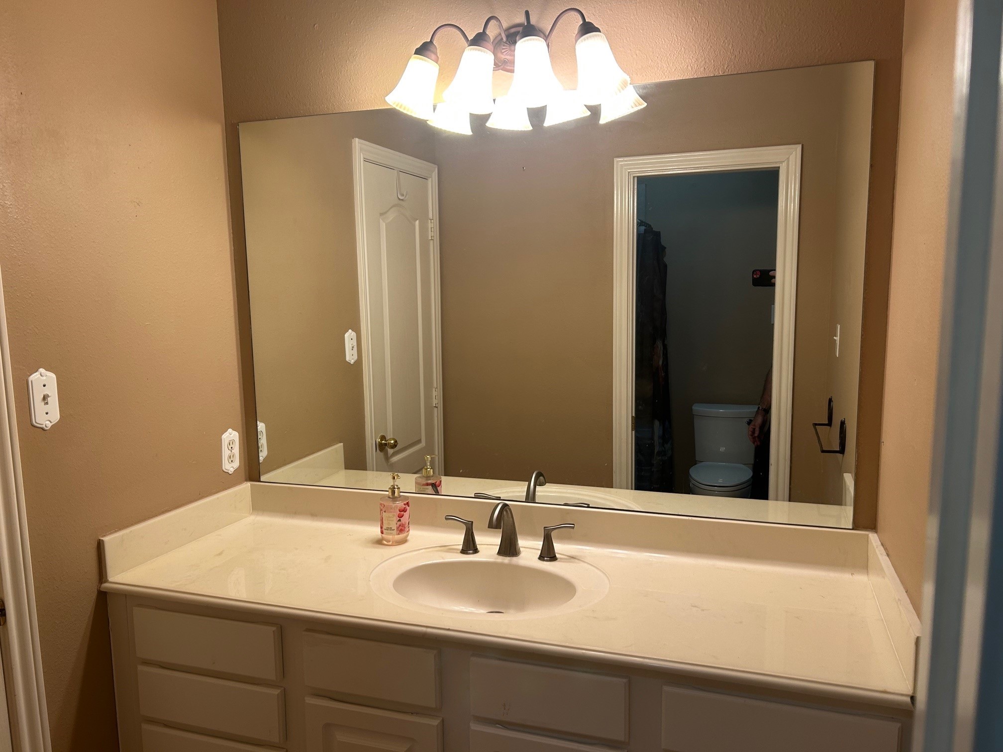 38094 Joe Loggins Road Hempstead, TX 77445 - Photo 11 of 32 a bathroom with a sink and a mirror