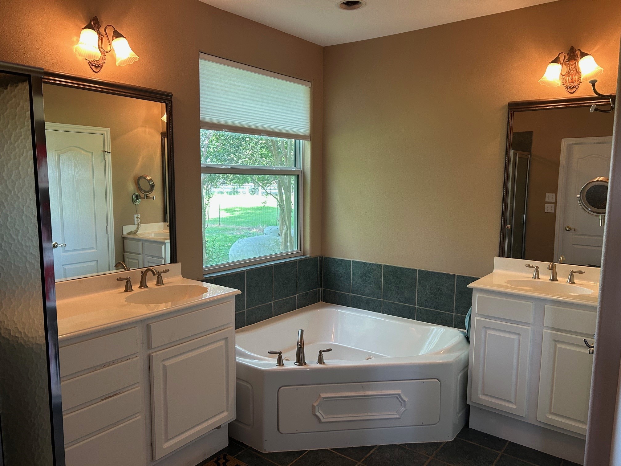 38094 Joe Loggins Road Hempstead, TX 77445 - Photo 7 of 32 a bathroom with a tub sink and mirror
