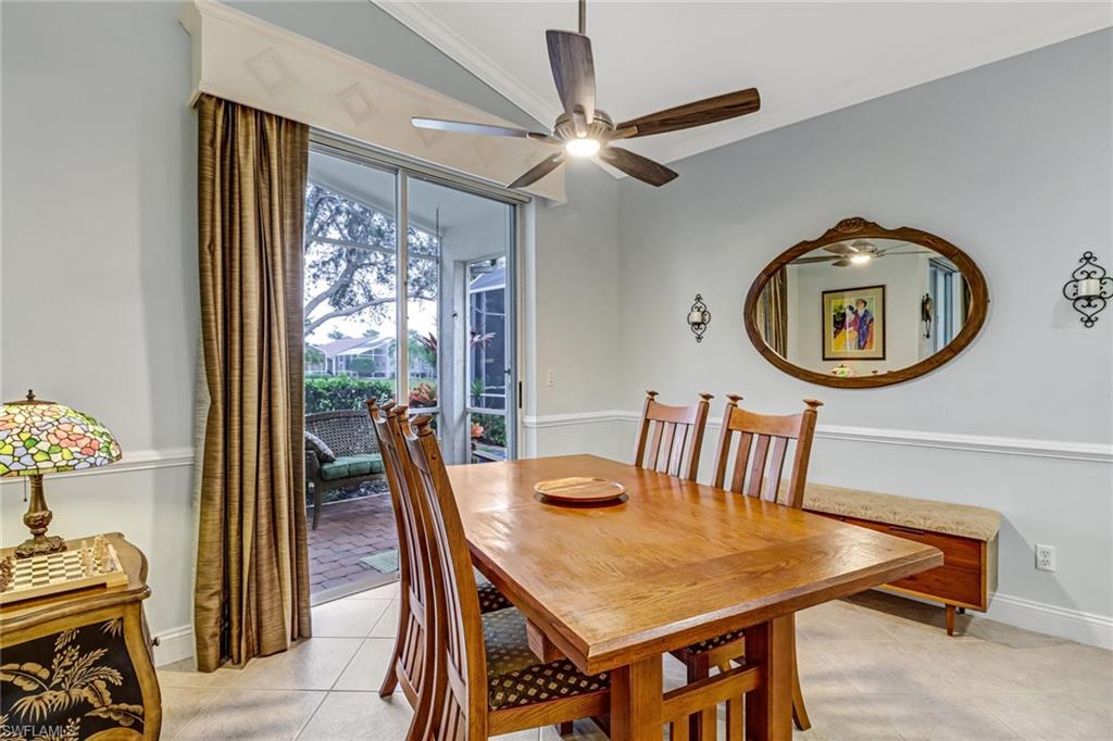 9157 Springview Loop Estero, FL 33928 - Photo 11 of 47 a view of a dining room with furniture and a chandelier