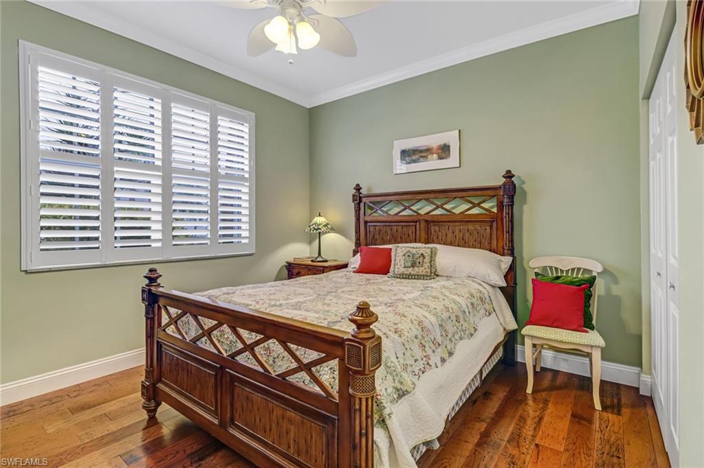 9157 Springview Loop Estero, FL 33928 - Photo 15 of 47 a bedroom with a bed a dresser and a window