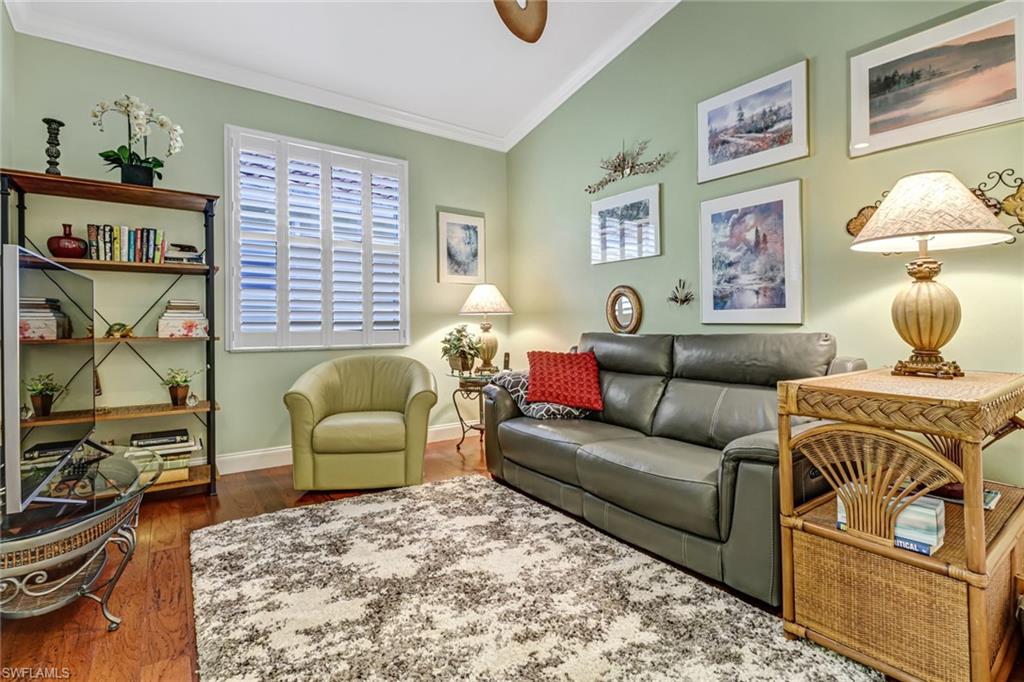 9157 Springview Loop Estero, FL 33928 - Photo 17 of 47 a living room with furniture and a flat screen tv