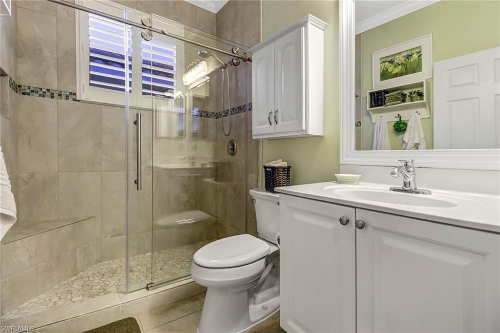 9157 Springview Loop Estero, FL 33928 - Photo 18 of 47 a bathroom with a sink toilet and shower
