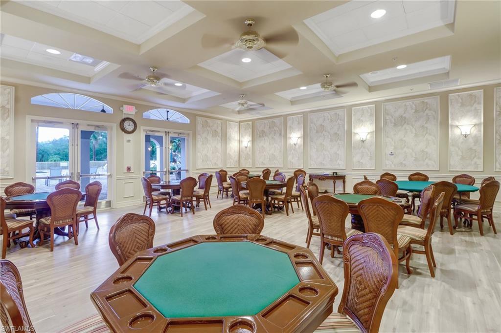 9157 Springview Loop Estero, FL 33928 - Photo 31 of 47 a room with lots of chairs and a glass door