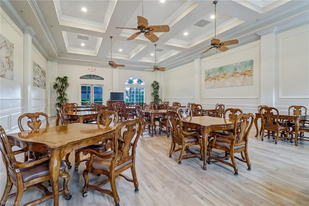 9157 Springview Loop Estero, FL 33928 - Photo 32 of 47 a view of a a dining room with furniture window and wooden floor