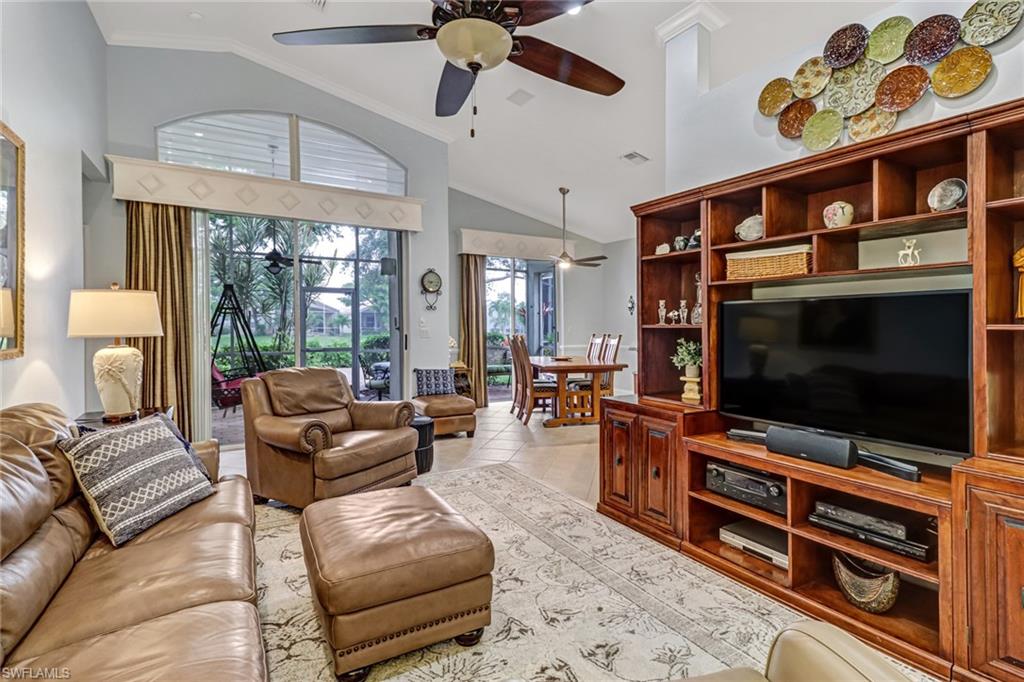 9157 Springview Loop Estero, FL 33928 - Photo 4 of 47 a living room with furniture and a flat screen tv