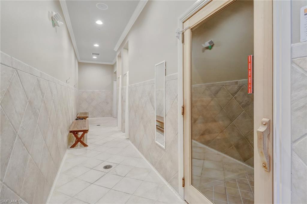 9157 Springview Loop Estero, FL 33928 - Photo 44 of 47 a hallway with sliding door and couch