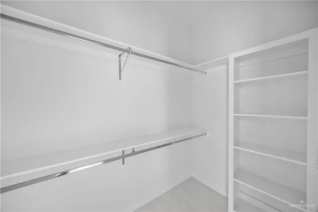 a view of an empty walk in closet