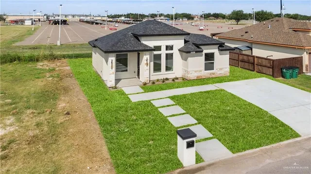an aerial view of a house with swimming pool