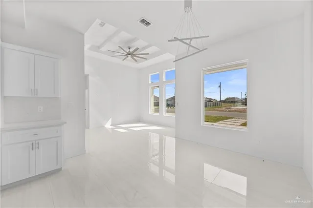 a view of a kitchen and a dishwasher a kitchen island with wooden floor