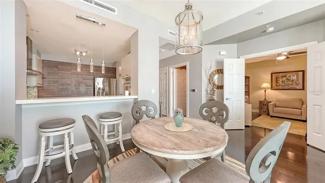 a living room with furniture fireplace and a large window