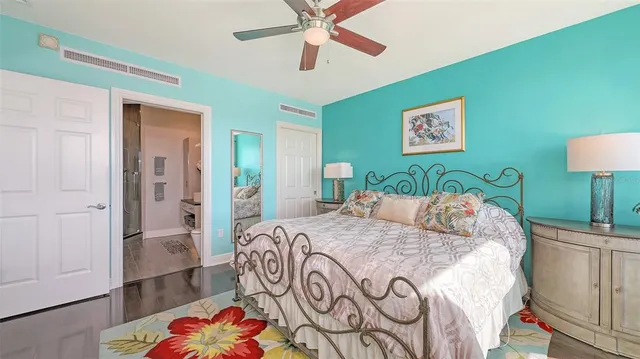 a bedroom with a bed a couch and dresser