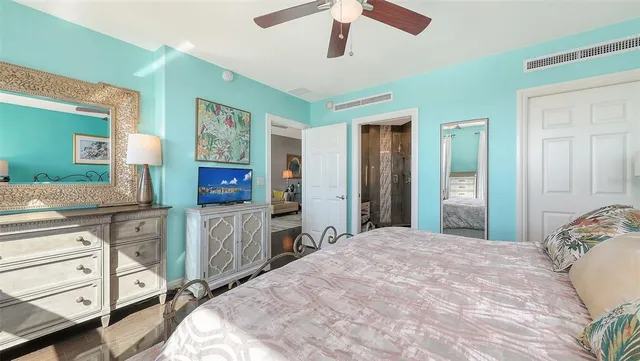 a bedroom with a bed and a lamp