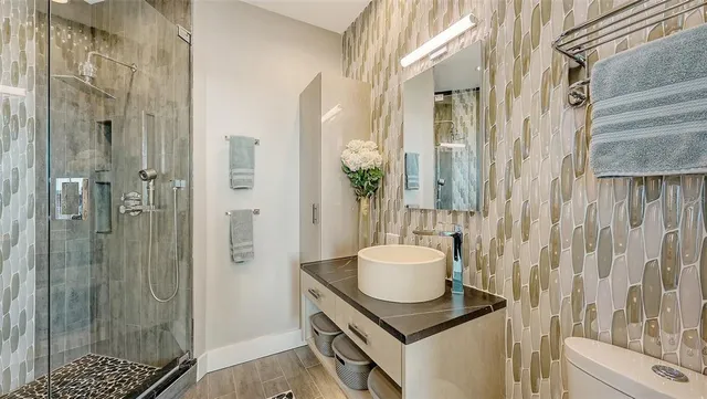 a utility room with dryer washer and other items