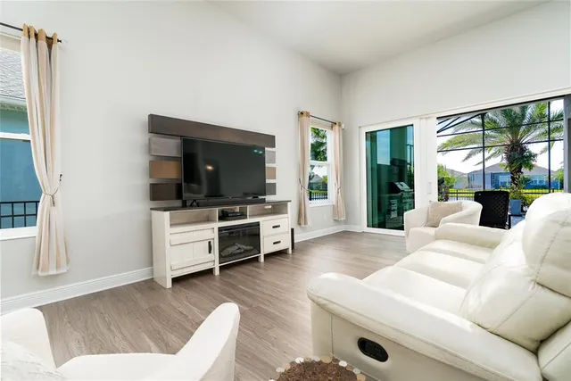 a bathroom with a granite countertop sink a mirror and a shower