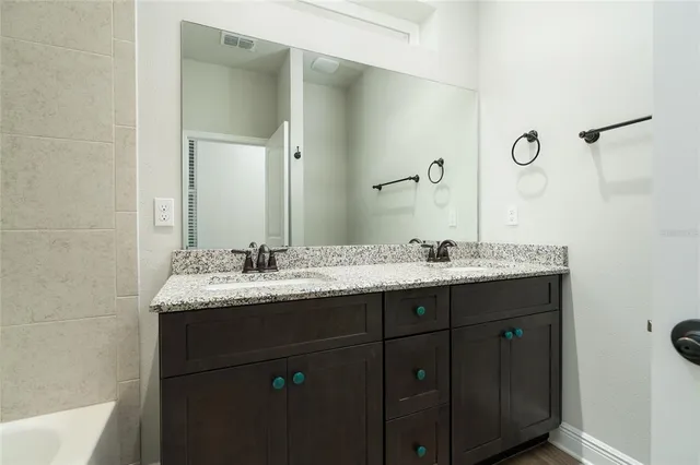 a living room with couch a table and a large window