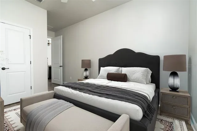 a view of a patio with table and chairs and potted plants