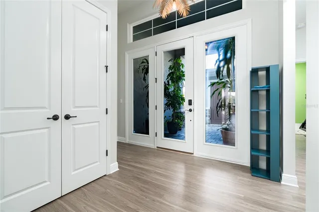 a kitchen with stainless steel appliances granite countertop a stove microwave refrigerator and sink