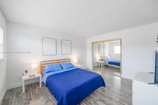 a bedroom with a bed and a table