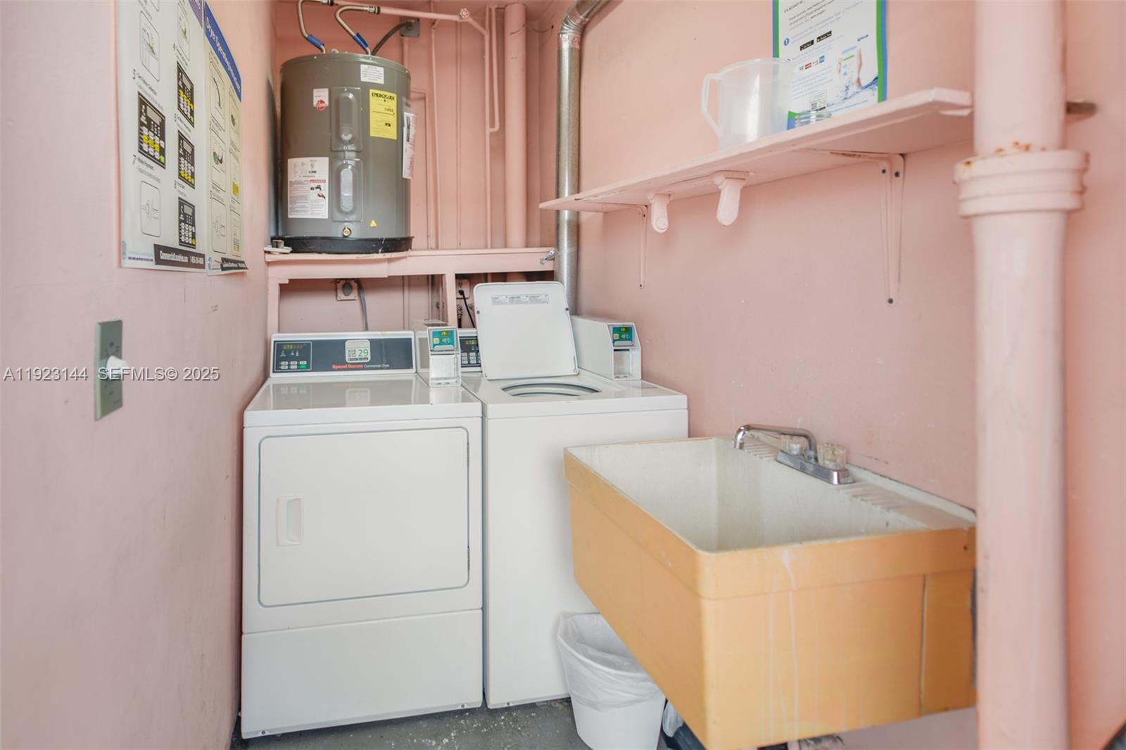200 Northeast 12th Avenue, Unit 6D Hallandale Beach, FL 33009 - Photo 30 of 36 a utility room with dryer and washer