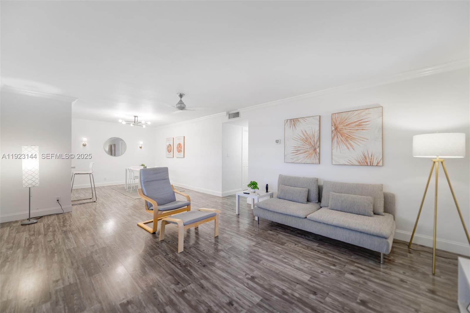 200 Northeast 12th Avenue, Unit 6D Hallandale Beach, FL 33009 - Photo 3 of 36 a living room with furniture and a wooden floor