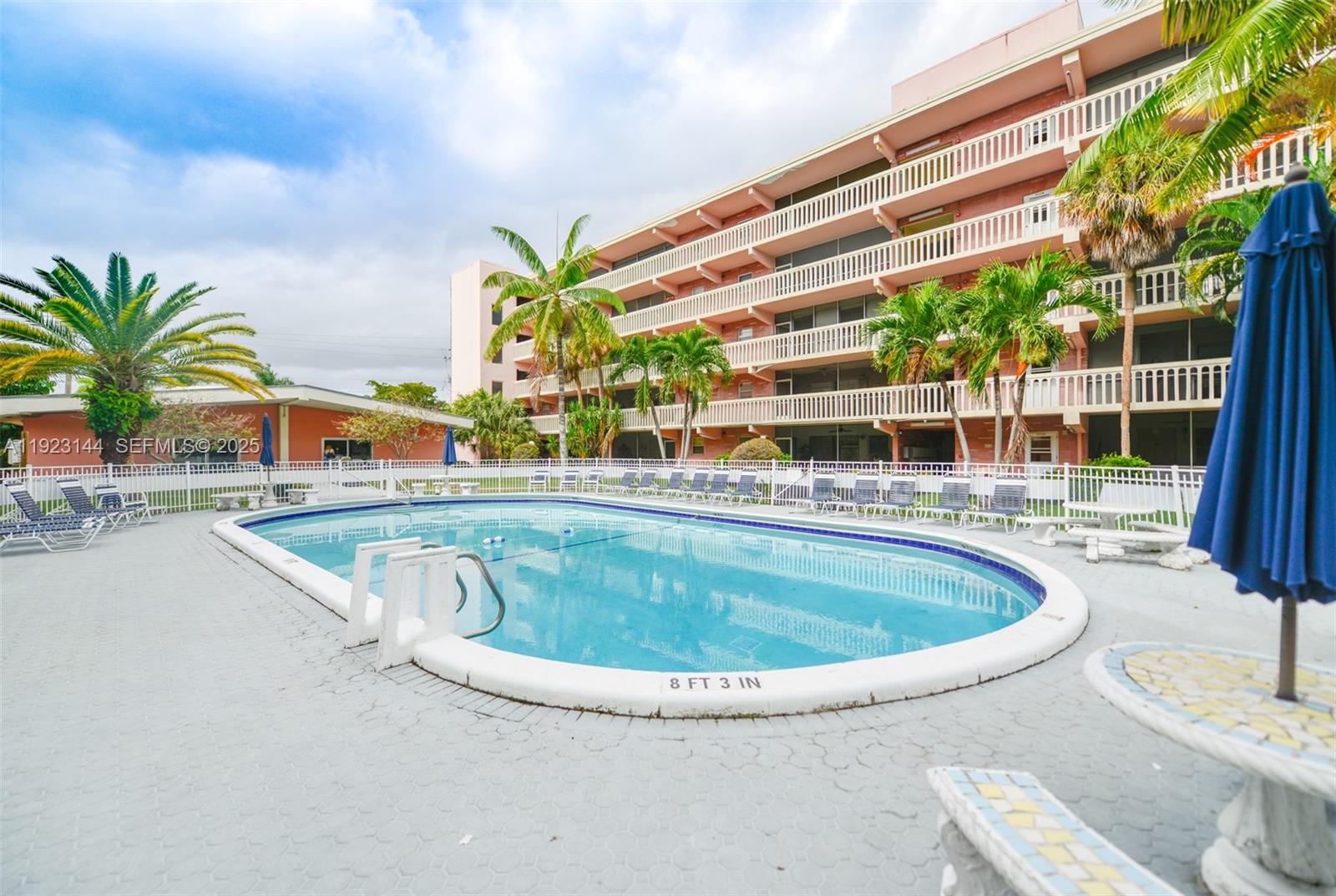 200 Northeast 12th Avenue, Unit 6D Hallandale Beach, FL 33009 - Photo 34 of 36 a view of swimming pool with outdoor seating and deck
