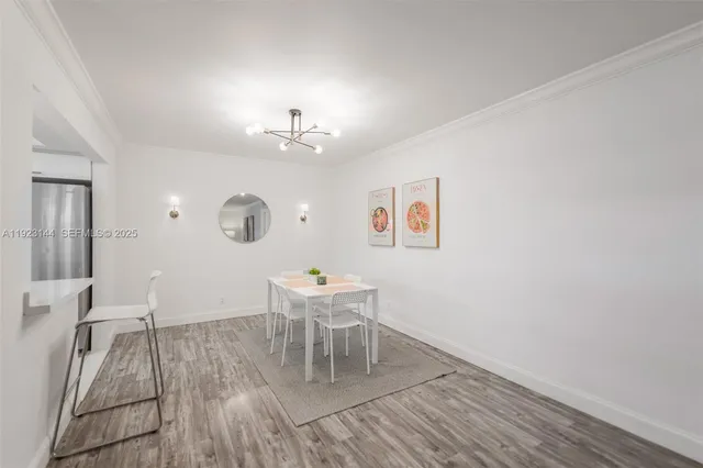a view of a livingroom with furniture and wooden floor