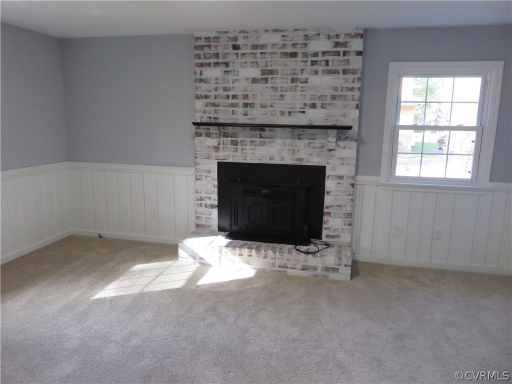 8573 Strath Road Henrico, VA 23231 - Photo 16 of 37 an empty room with a fireplace